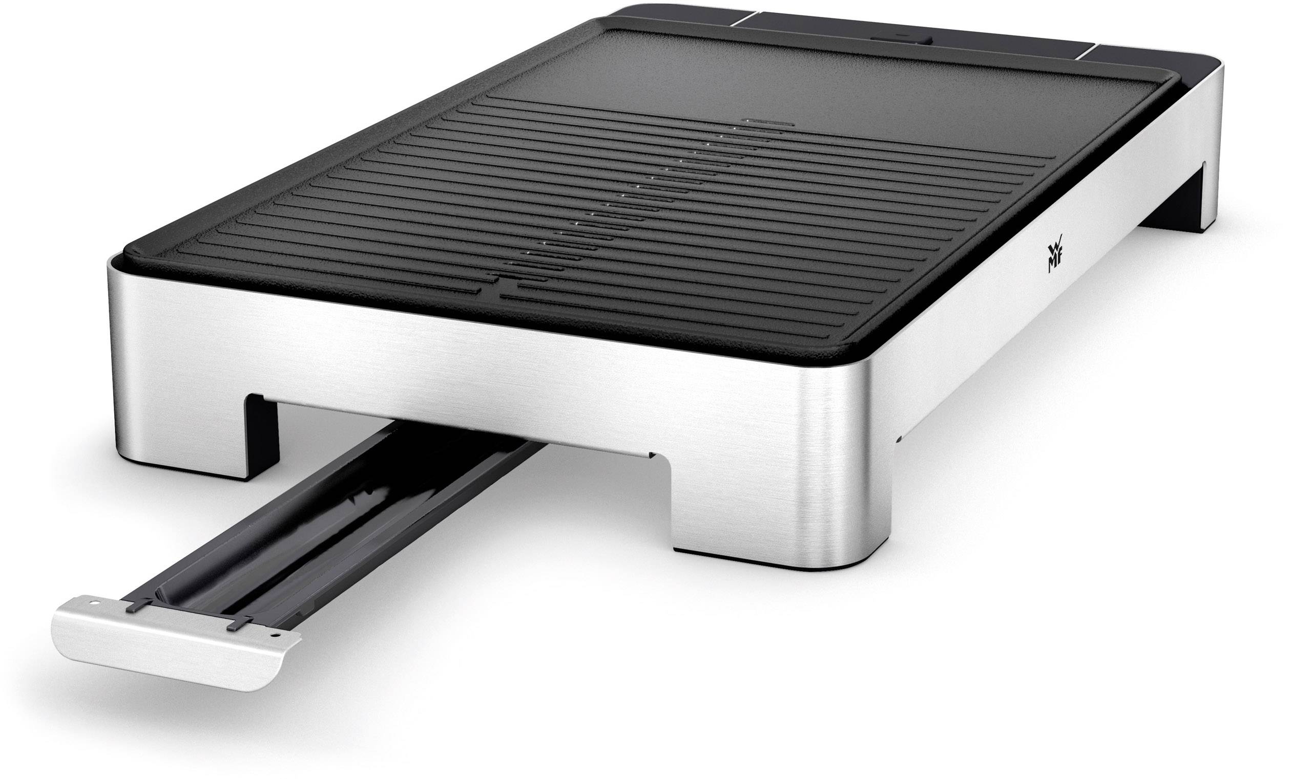 Ein elektrischer Tischgrill mit schlichter, moderner Edelstahloptik und geriffelter Grillfläche, ausgezogener Fettauffangschale.