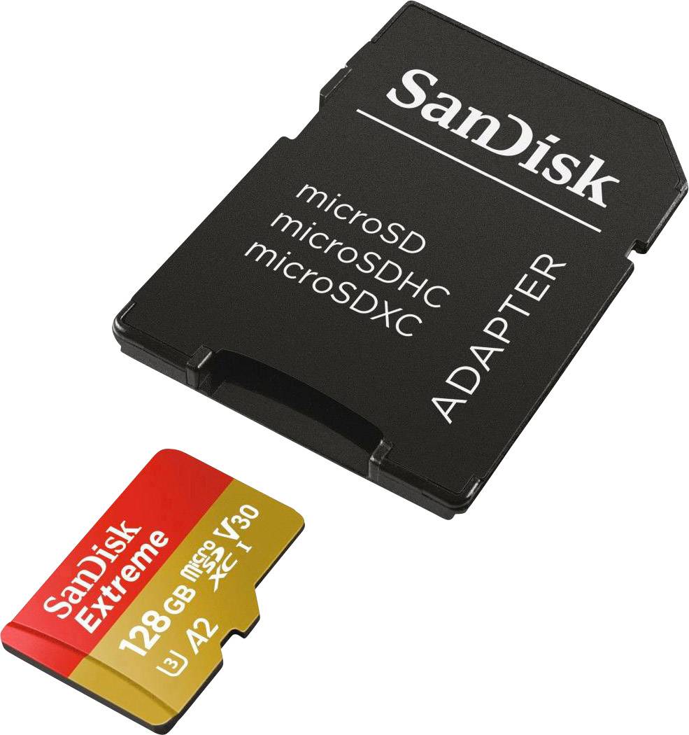 Eine SanDisk microSD-Karte mit 128 GB in rot-goldener Farbe liegt vor einem schwarzen Adapter.