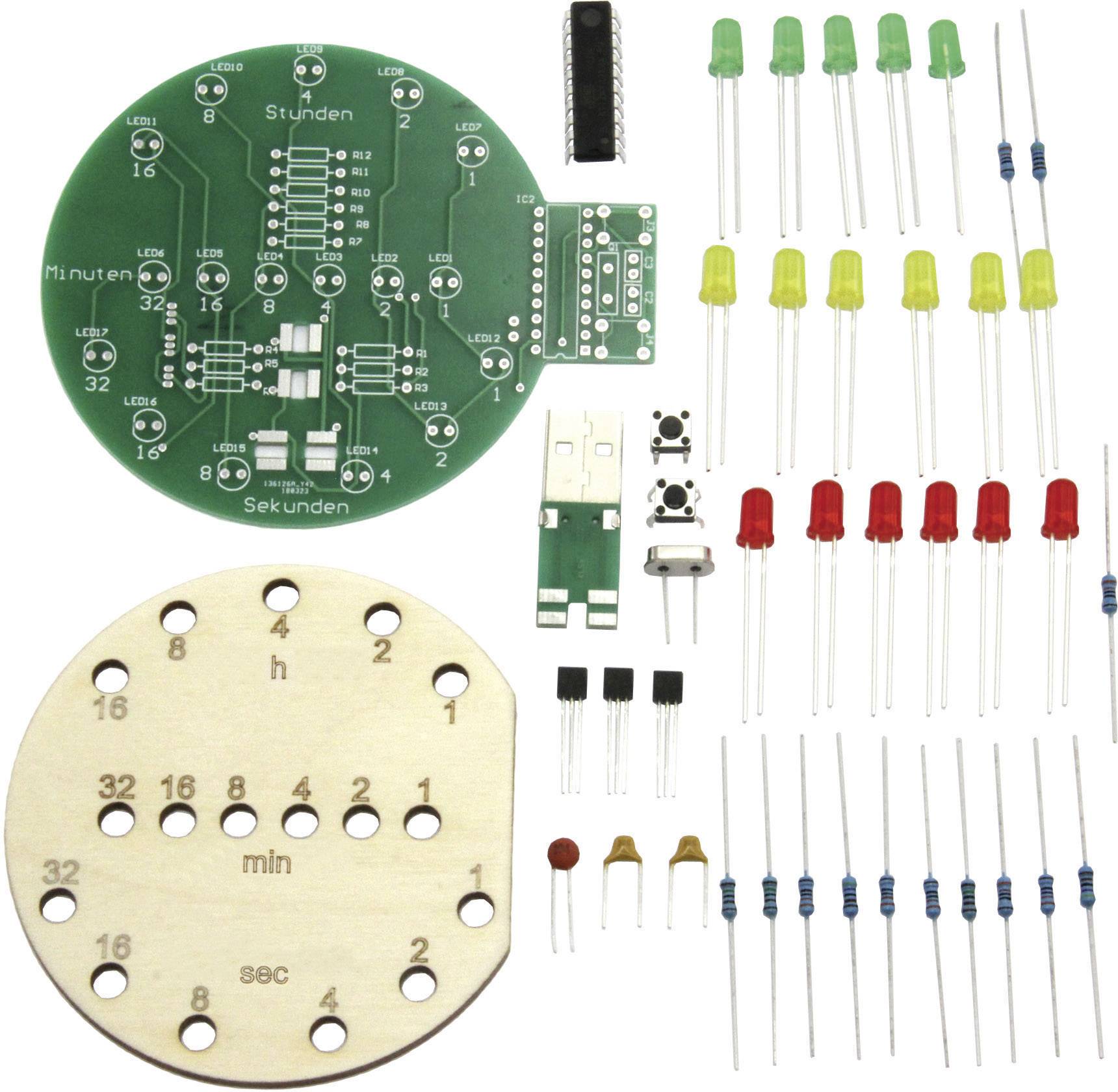 Ein Elektronik-Bausatz bestehend aus einer runden Leiterplatte, LEDs, Widerständen, Kondensatoren und einem Holzschild mit Zahlen.