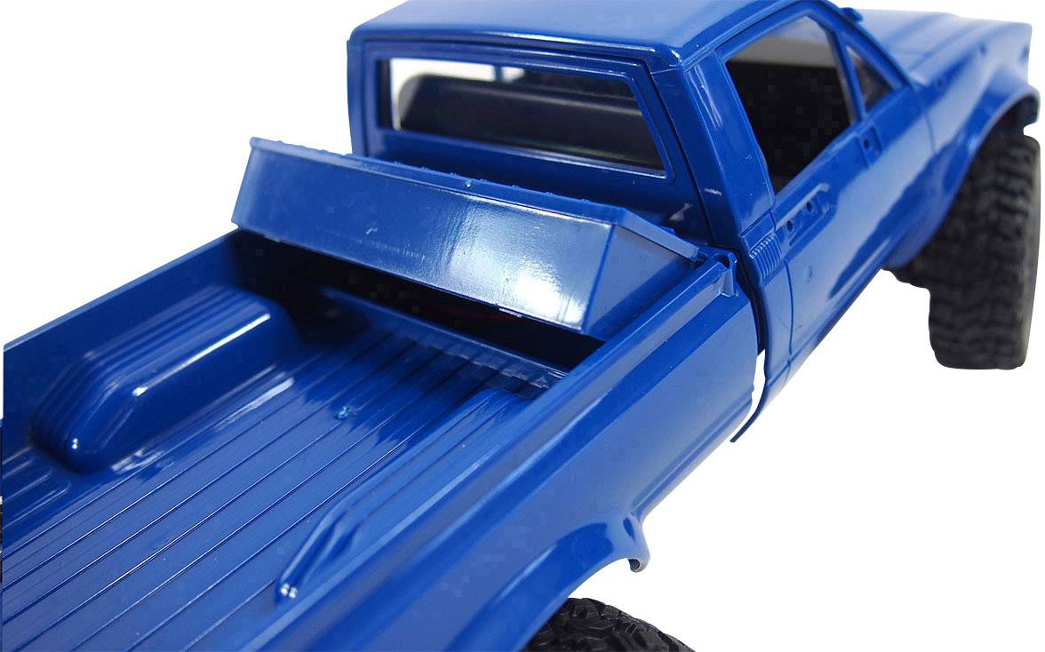 Blauer Spielzeug-Pick-up-Truck aus Plastik, Ansicht von hinten, mit offener Ladefläche und klappbarem Deckel.