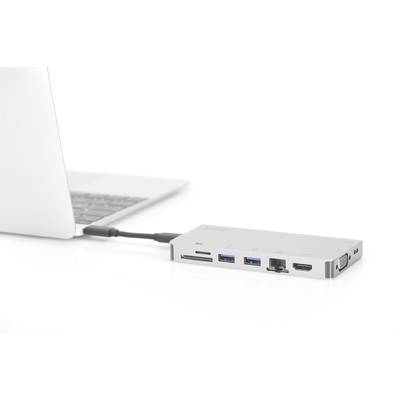 Ein Laptop ist mit einem externen Adapter verbunden, der mehrere Anschlüsse wie USB, HDMI und Ethernet bietet.