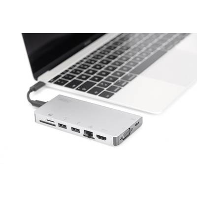 'Laptop mit angesteckter USB-C-Dockingstation. Die Dockingstation hat mehrere Anschlüsse, darunter USB, HDMI und Ethernet.'