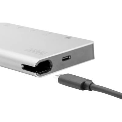 Ein USB-C-Stecker liegt vor einem USB-C-Hub mit mehreren Anschlüssen. Der Fokus liegt auf der Kompatibilität von Geräten.