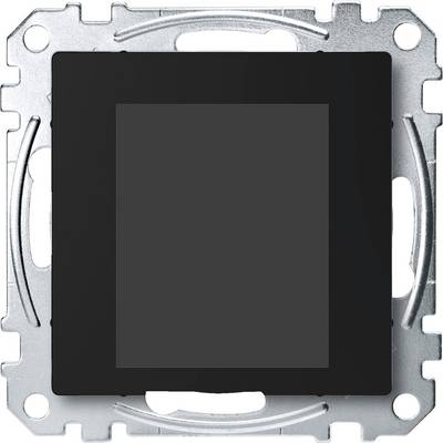 Ein quadratischer, schwarzer Lichtschalter ohne sichtbare Bedienelemente, eingebettet in eine metallene Halterung.