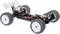 Ferngesteuertes Auto-Chassis mit vier großen Offroad-Reifen. Die Aufhängung und Federung sind sichtbar, mit einem elektronischen System in der Mitte.