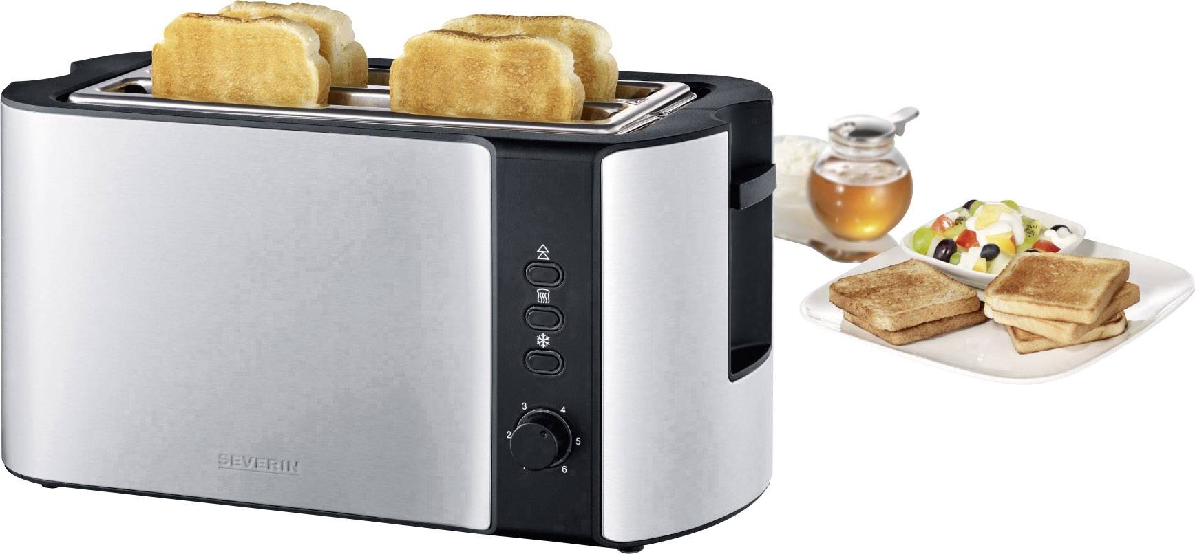 Ein silberner Toaster röstet Brot. Im Hintergrund sind Honig, Obst und geröstetes Brot auf einem Teller zu sehen.