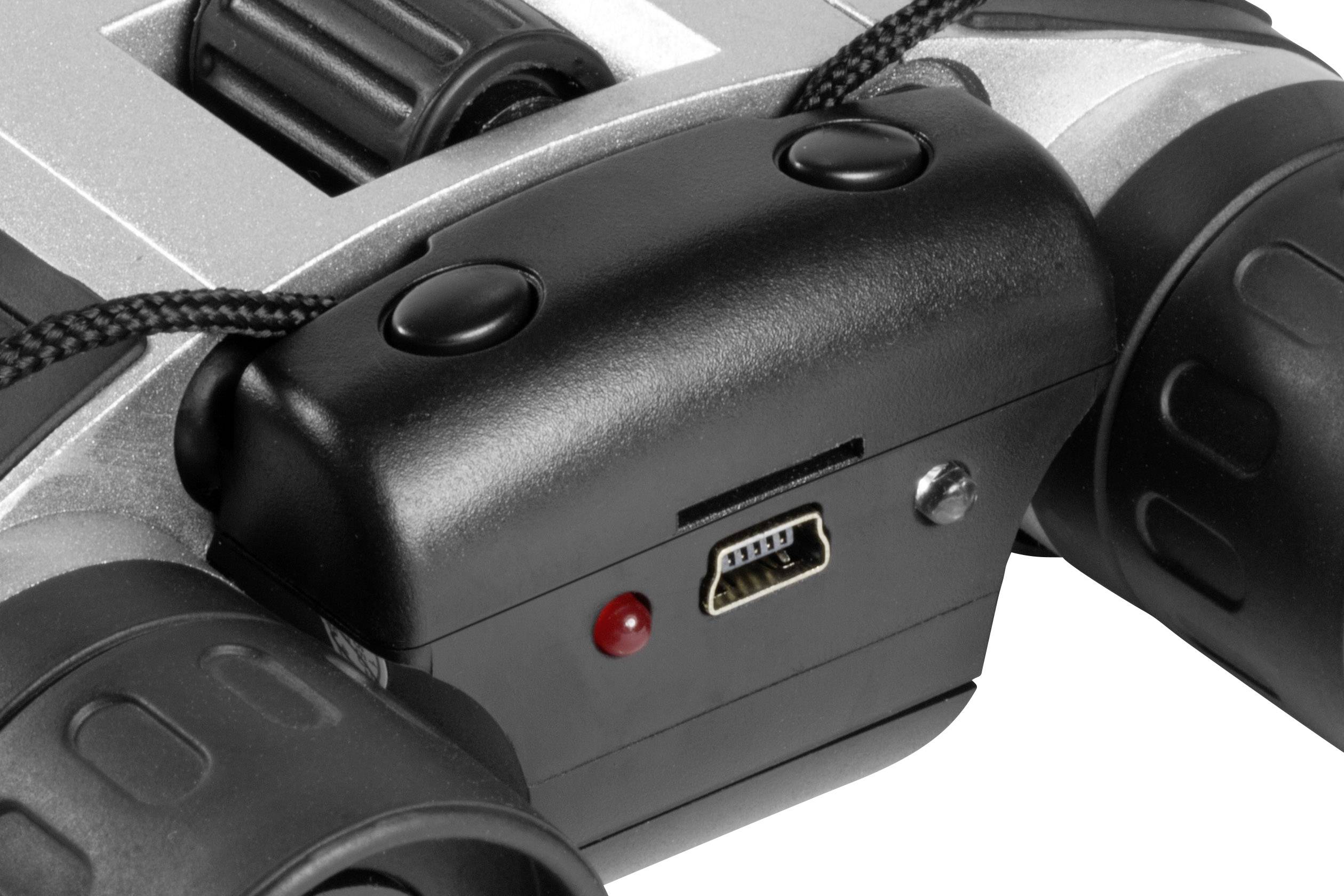 'Nahaufnahme eines Fernglases mit einem USB-Anschluss und einem roten LED-Licht an der Seite, um Funktionen oder Ladezustand anzuzeigen.'