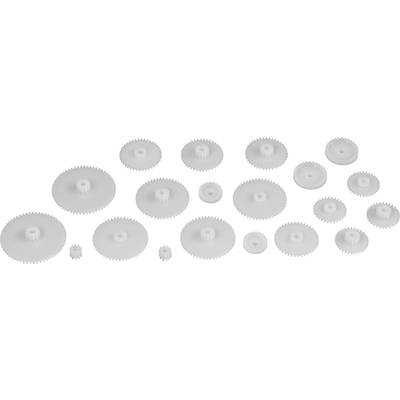Verschiedene Plastikzahnräder in unterschiedlichen Größen liegen auf einer glatten Oberfläche verteilt.