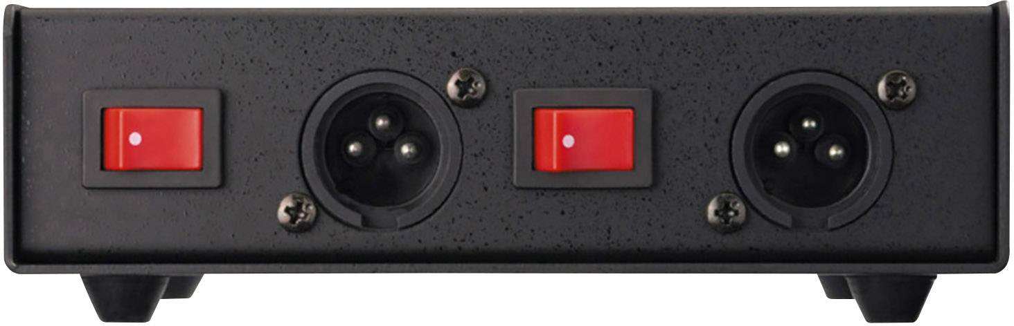 Ein schwarzes elektronisches Gerät mit zwei roten Schaltern und zwei runden Steckverbindungen auf der Vorderseite.