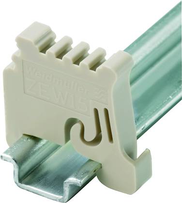 'Weidmüller ZEW15'-Klemme auf Metallschiene montiert. Beige Kunststoffklemmblock mit stromführender Schiene darunter sichtbar.