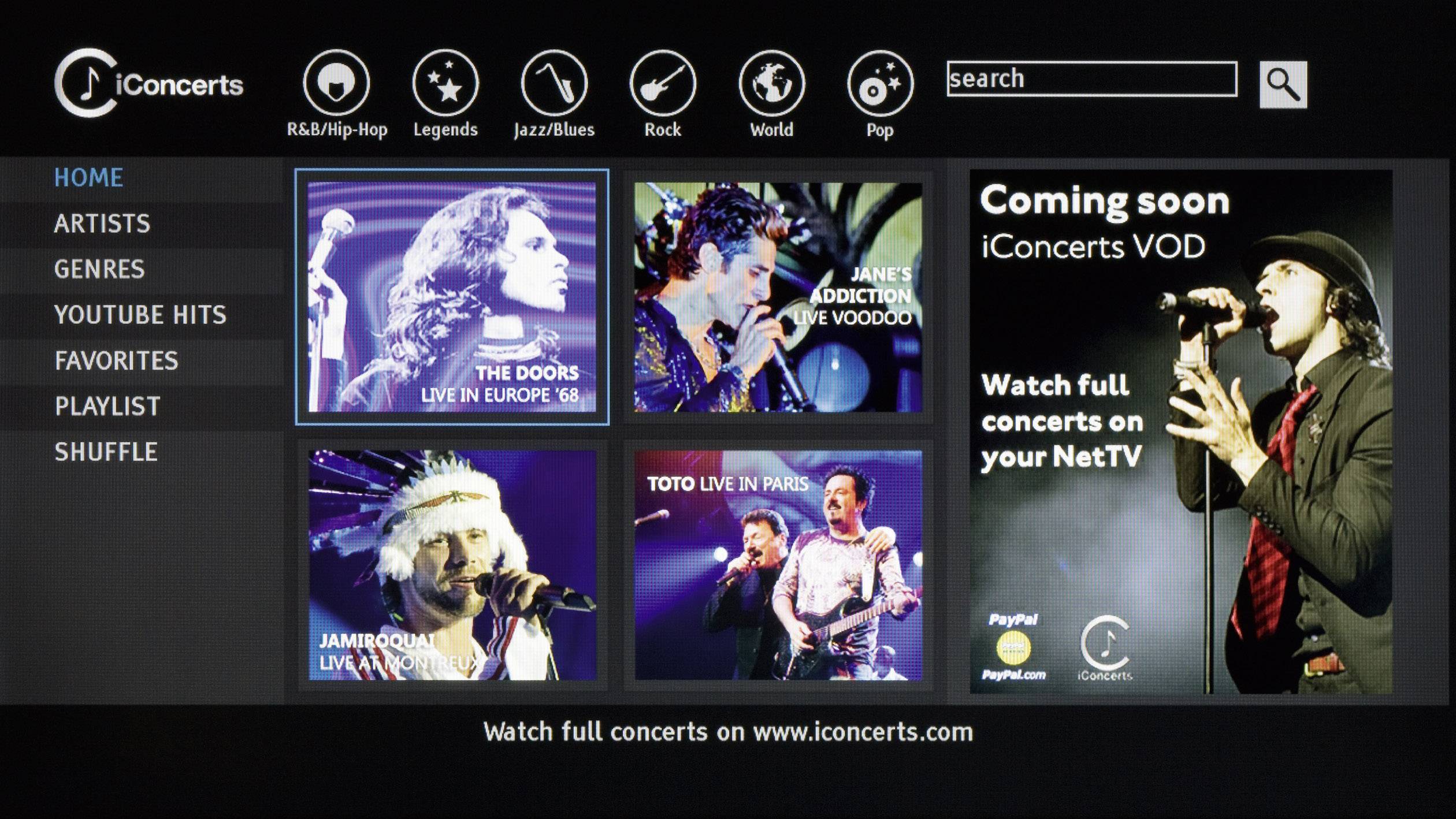 Screenshot einer Musik-Streaming-Oberfläche mit verschiedenen Künstleroptionen. Hauptmenü links: Home, Künstler, Genres. Werbung für bevorstehende Konzerte rechts.