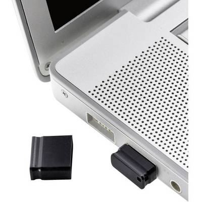 Ein schwarzer USB-Stick wird an einen Laptop angeschlossen. Neben dem Laptop liegt die Kappe des USB-Sticks auf dem Tisch.