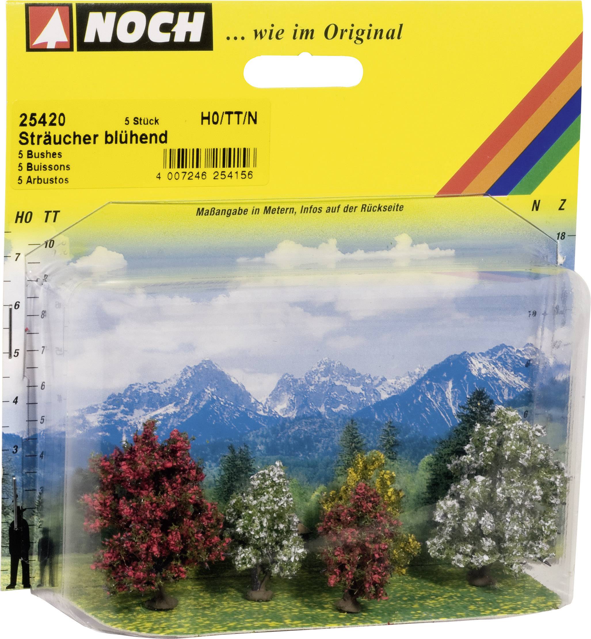 'Noch' Modellbausatz mit 5 blühenden Sträuchern, vor Alpenpanorama. Verpackung in Gelb mit Produktinformationen.