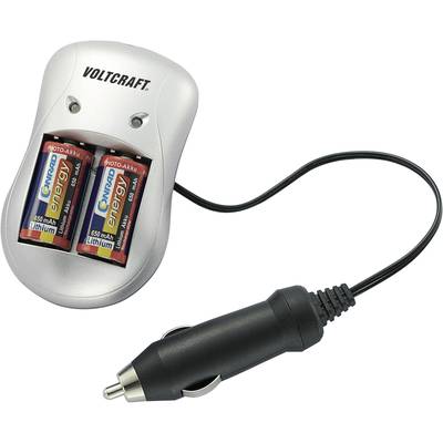 Ladegerät mit zwei eingesetzten AA-Batterien und Autoadapterkabel, Marke 'Voltcraft'.