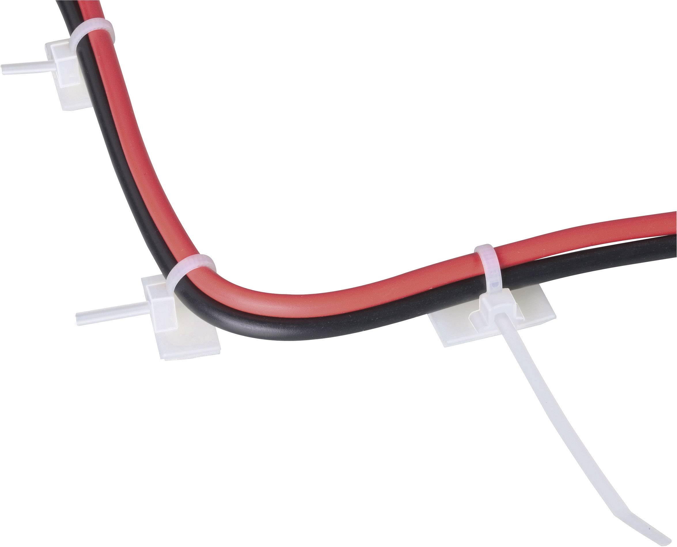 Zwei Kabel, schwarz und rot, werden mit weißen Kabelbindern auf einer Oberfläche fixiert.