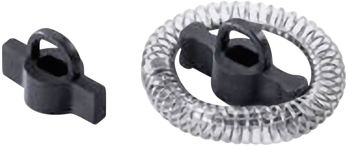 Zwei schwarze Kunststoffteile: ein kleineres Rundstück links und ein größeres mit spiralförmigen Rand rechts, liegen nebeneinander.