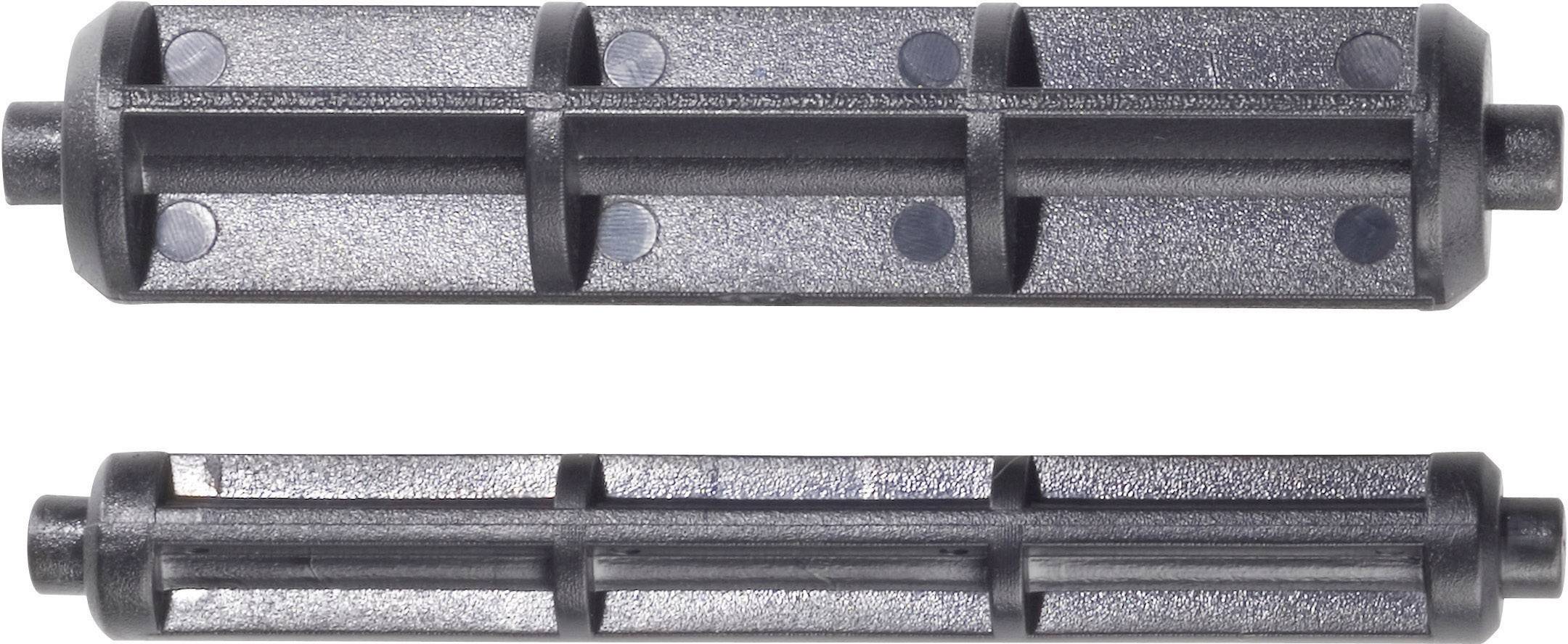 'Zwei schwarze Kunststoffrollen, eine größere oben und eine kleinere unten, mit mehreren Löchern und geripptem Design.'