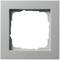 Silberner quadratischer Rahmen mit leerem Innenbereich, vermutlich für Lichtschalter oder Steckdose. Schlichtes Design, metallische Optik.
