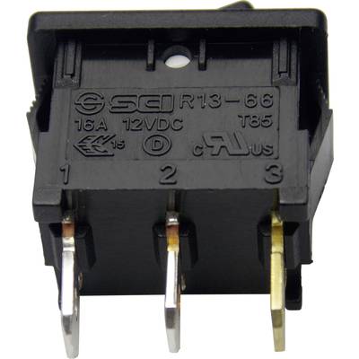 Ein schwarzer Wippschalter mit der Beschriftung 'SCI R13-66', spezifiziert für 16A, 12VDC. Er hat drei Anschlussklemmen.