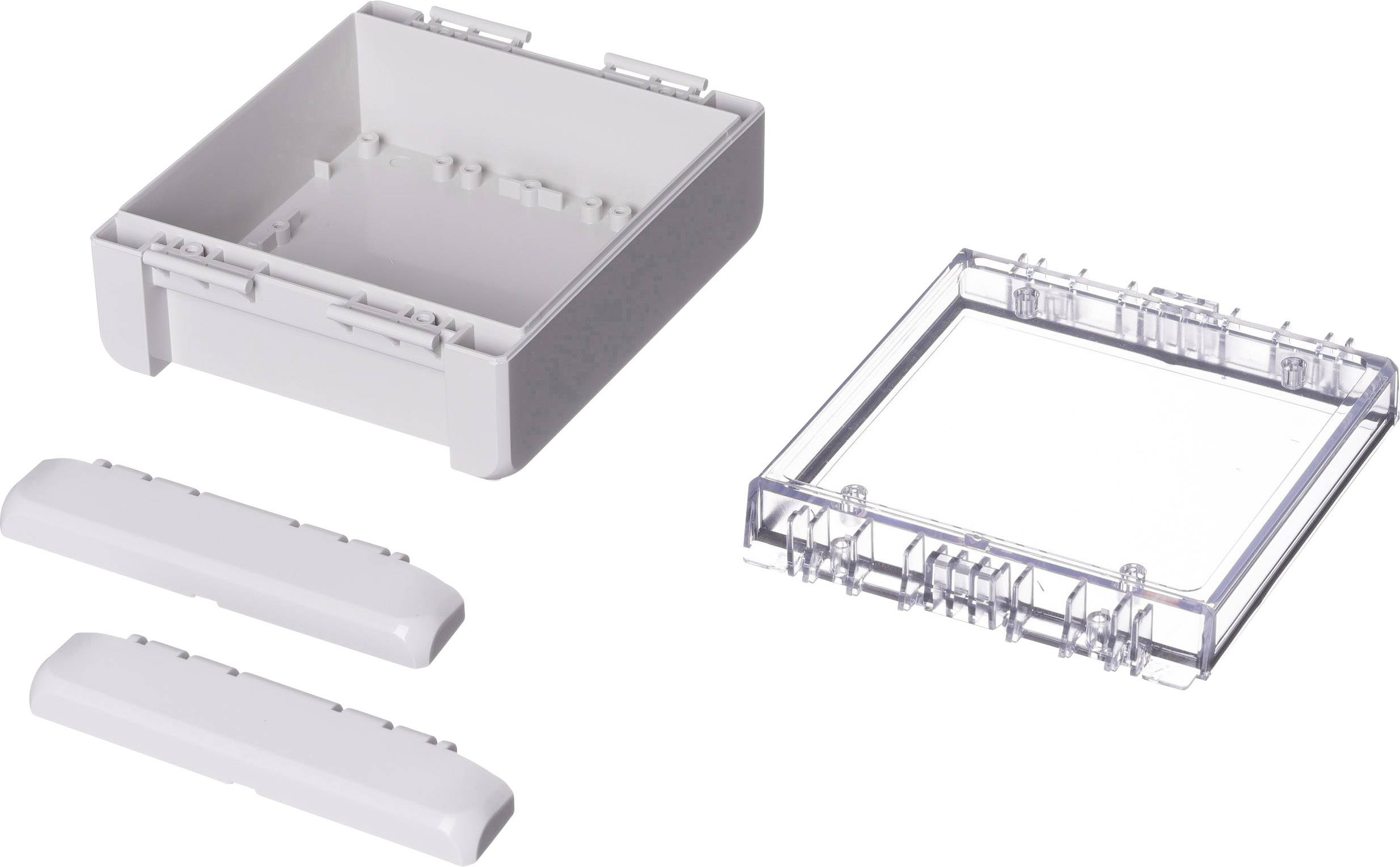Ein weißer Kunststoffkasten mit abnehmbarem, durchsichtigem Deckel und zwei separaten, länglichen Abdeckungen.