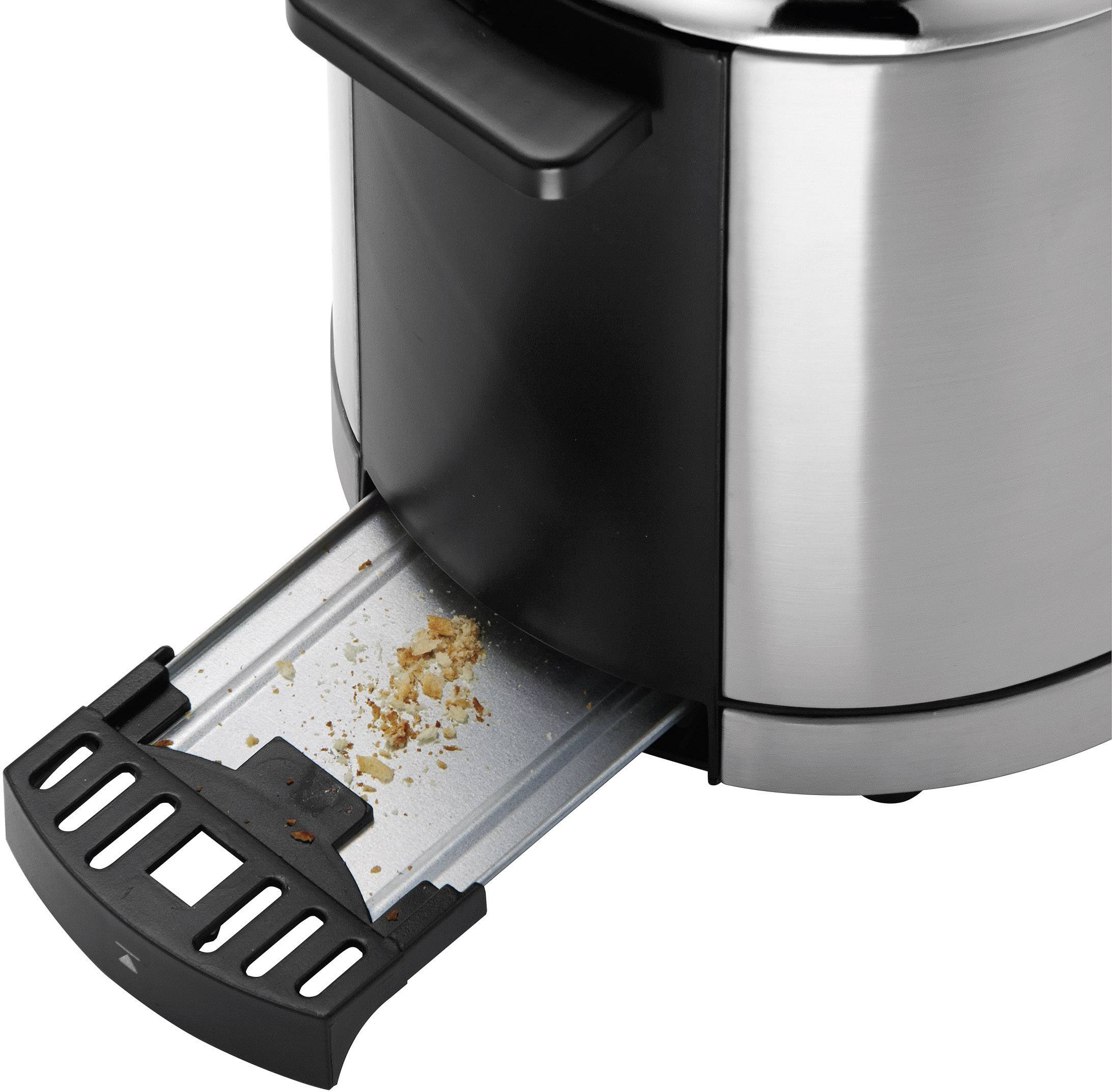 Ein Toaster mit herausziehbarem Krümelblech, das Krümel und Brotstücke gesammelt hat. Zeigt Sauberkeitsfunktion des Toasters.