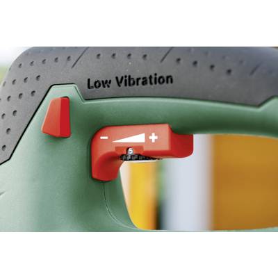 Nahaufnahme eines grünen Werkzeugs mit rotem Schalter, Beschriftung 'Low Vibration' und Regler mit Symbolen für Minus und Plus zur Einstellung der Vibrationsintensität.