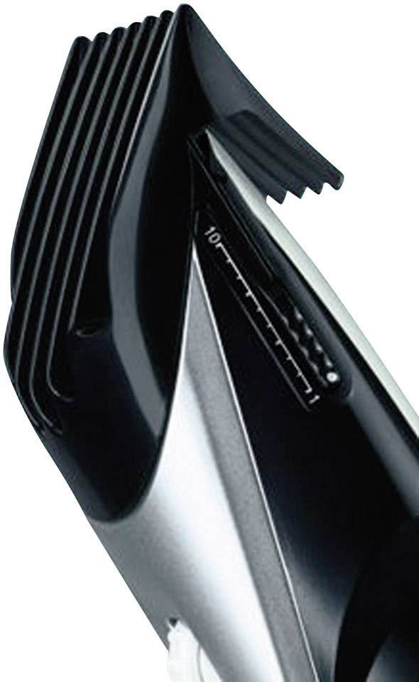 Ein elektrischer Haarschneider mit einstellbarem Kammaufsatz zur Anpassung der Schnittlänge, schwarzes und silbernes Design.