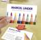 Visitenkarte mit bunten Bleistiften, Aufschrift 'Marcel Linder, Artist Materials and Supplies', inklusive Adresse und Telefonnummer.
