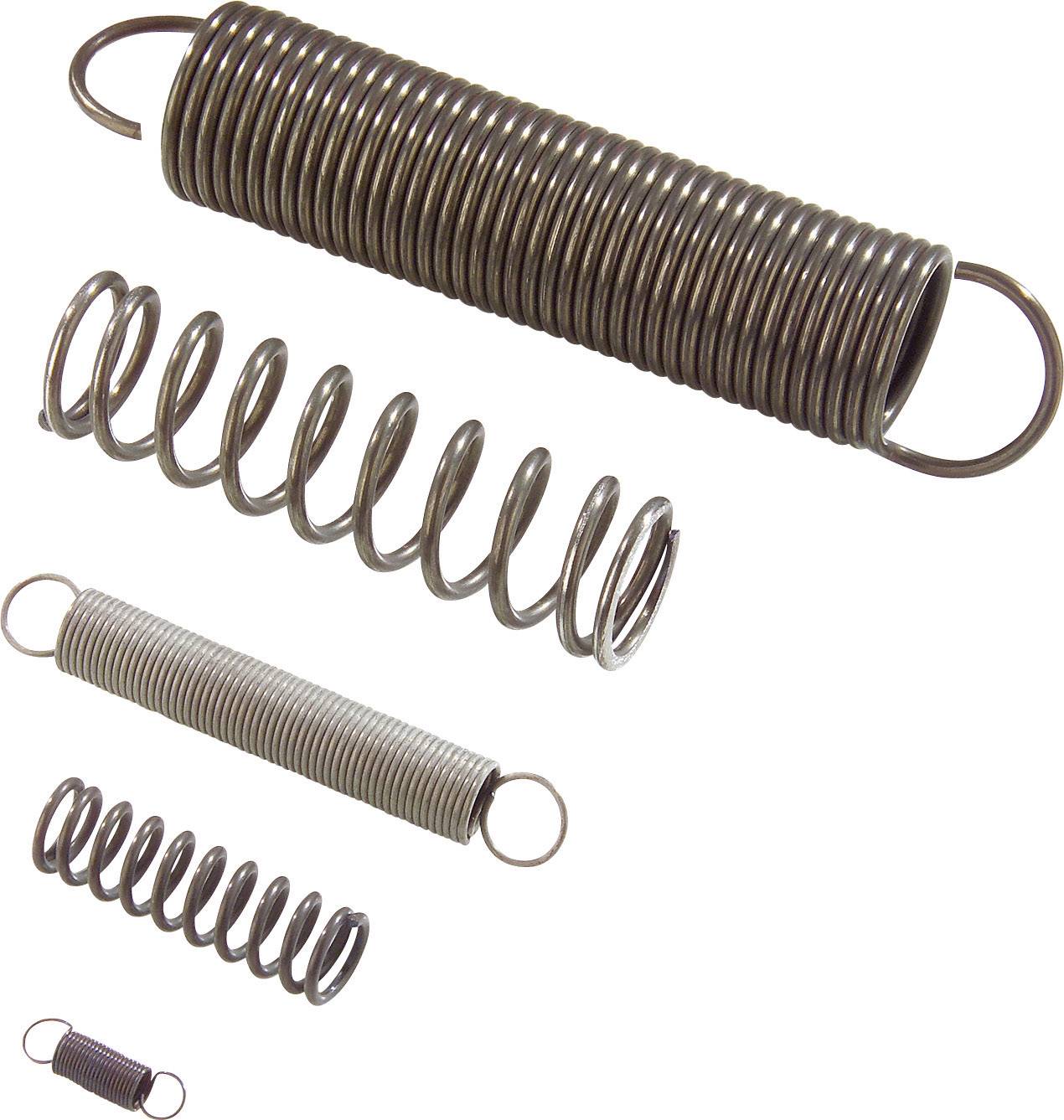 Vier Metallfedern unterschiedlicher Größe und Dichte liegen nebeneinander, zeigen Variationen in Wicklung und Spannung.