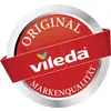 Rundes Logo mit rotem Hintergrund und silbernem Rand. In der Mitte steht 'vileda' in Weiß, darum 'Original' und 'Markenqualität'.
