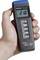 Hand holding a digital thermometer displaying '210°C', with buttons labeled 'MAX/MIN', 'HOLD', 'Δ REL', and a switch for '°C/°F'.
