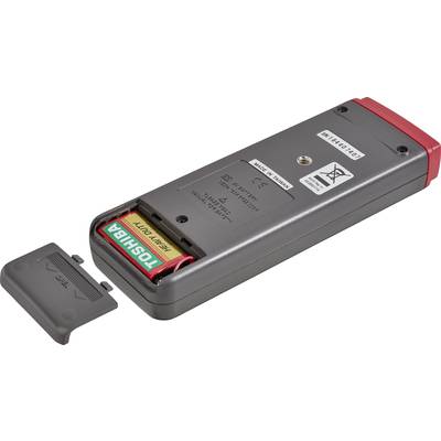 Back of a remote control with an open battery compartment and two visible AA batteries. Battery compartment cover is lying beside it.