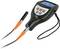A hand-held measuring device with a digital display and two connected cables, used for measuring coating thicknesses.