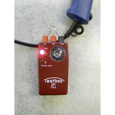 Red electrical testing device 'Testboy 20 Plus' on a grey background, displaying a glowing red LED with test probes.