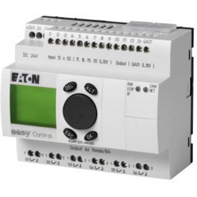 Industrial controller with green display and numeric keypad. Brand name and various ports visible.