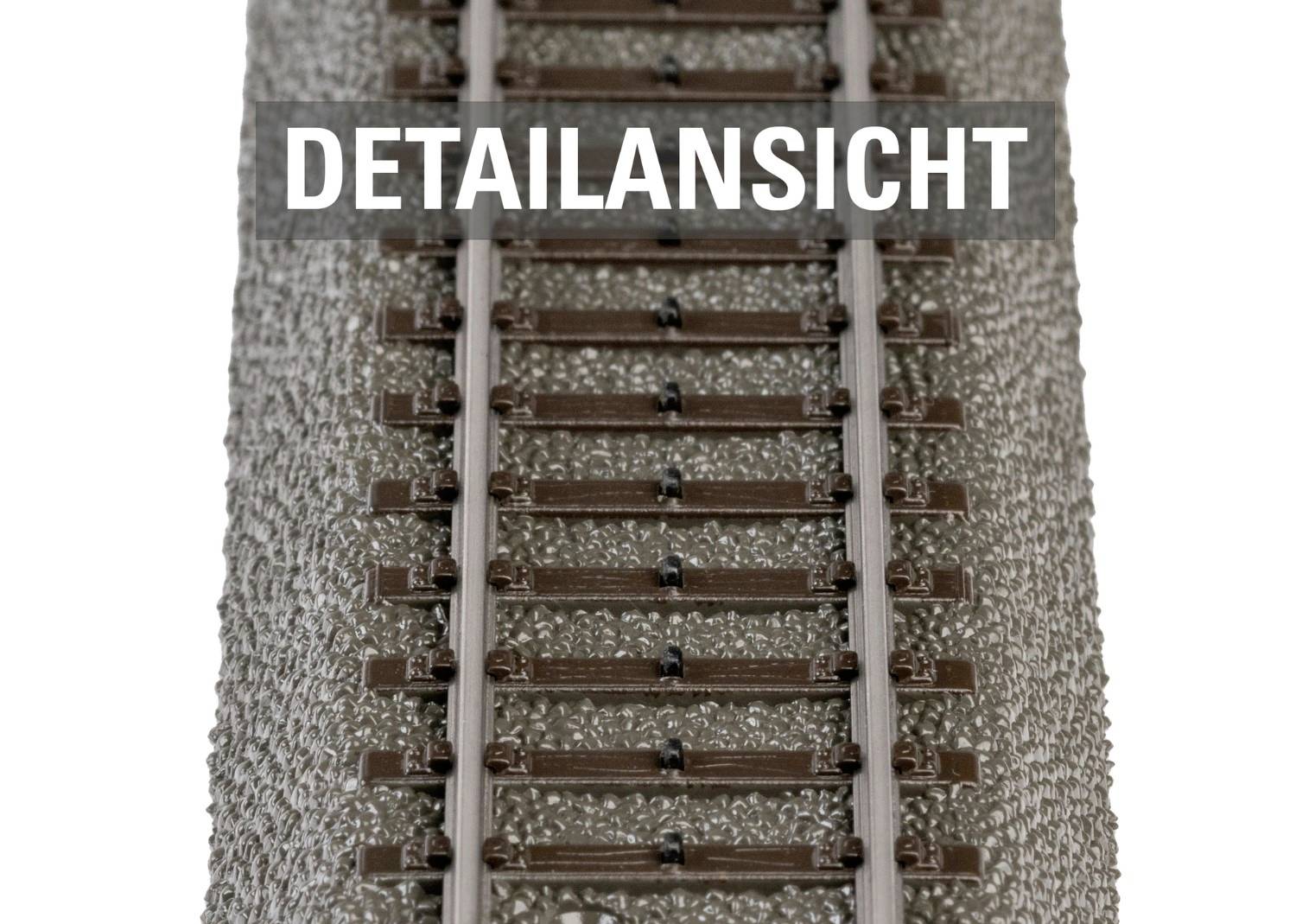 Close-up view of model railway tracks, with ballast bed and rails visible. Text 'DETAILED VIEW' above.
