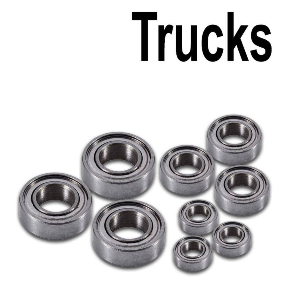 Eight ball bearings of different sizes on a white background. At the top, the text reads: Trucks.