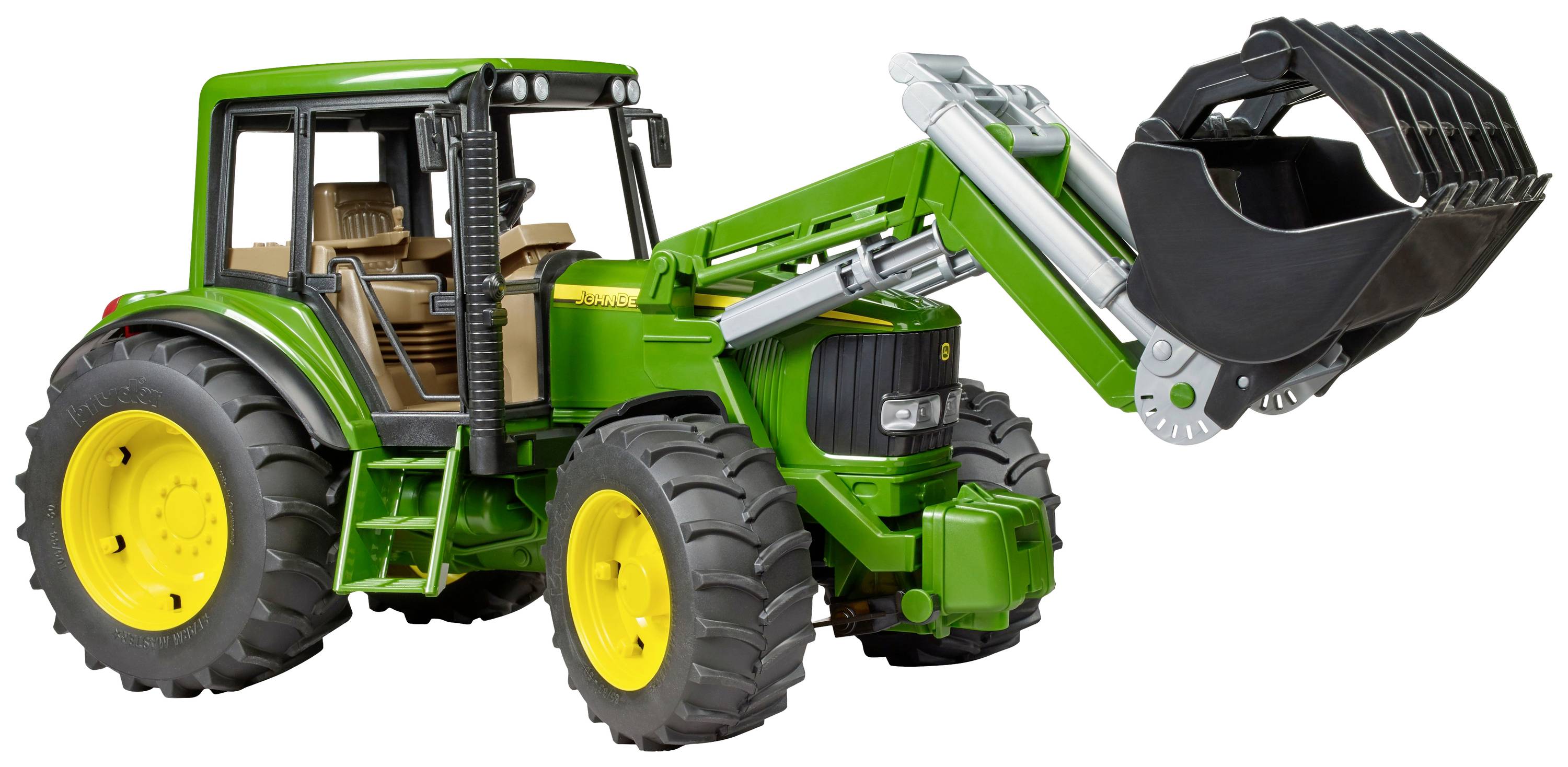 A green tractor with a front loader and large tyres is standing on a white background. The loader is raised and facing forwards.