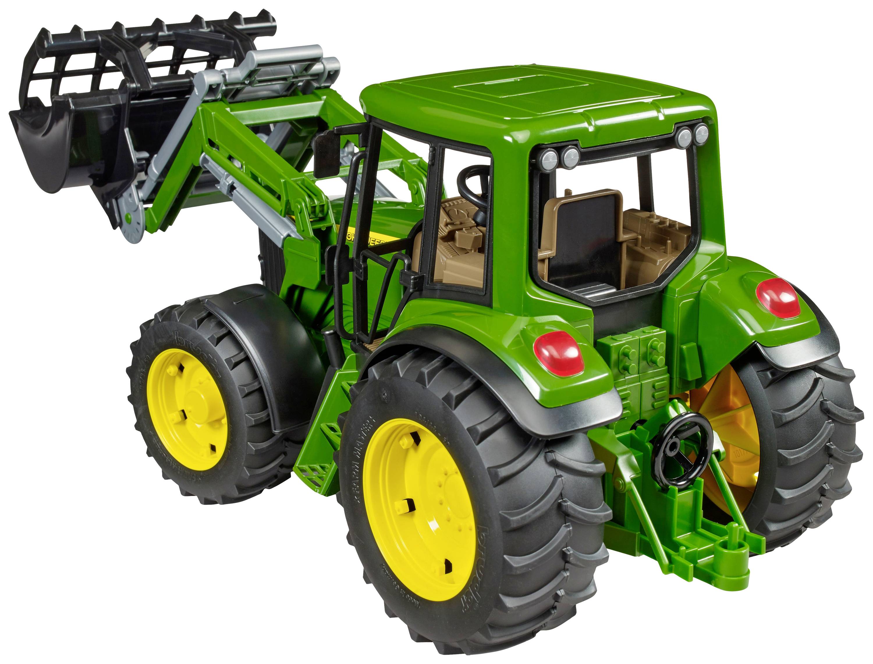 A green tractor with yellow wheels and a front loader. It has a detailed driver's cab and robust tyres.