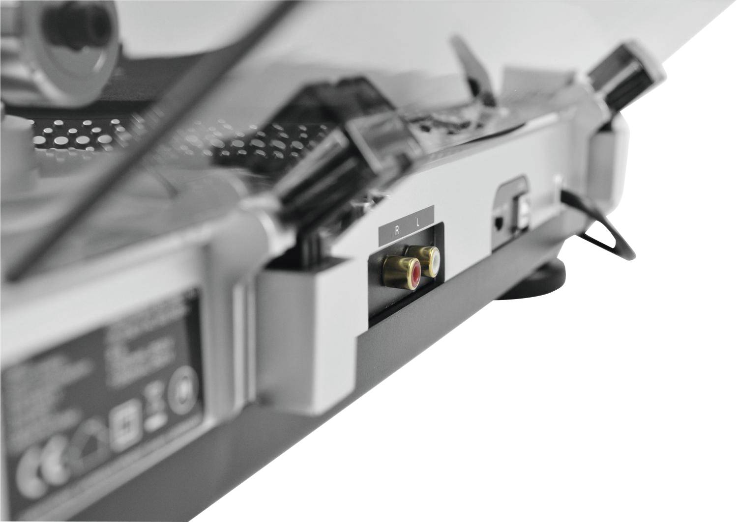 Close-up of the back of a record player, showing sockets for audio cables, including a red and a white socket.