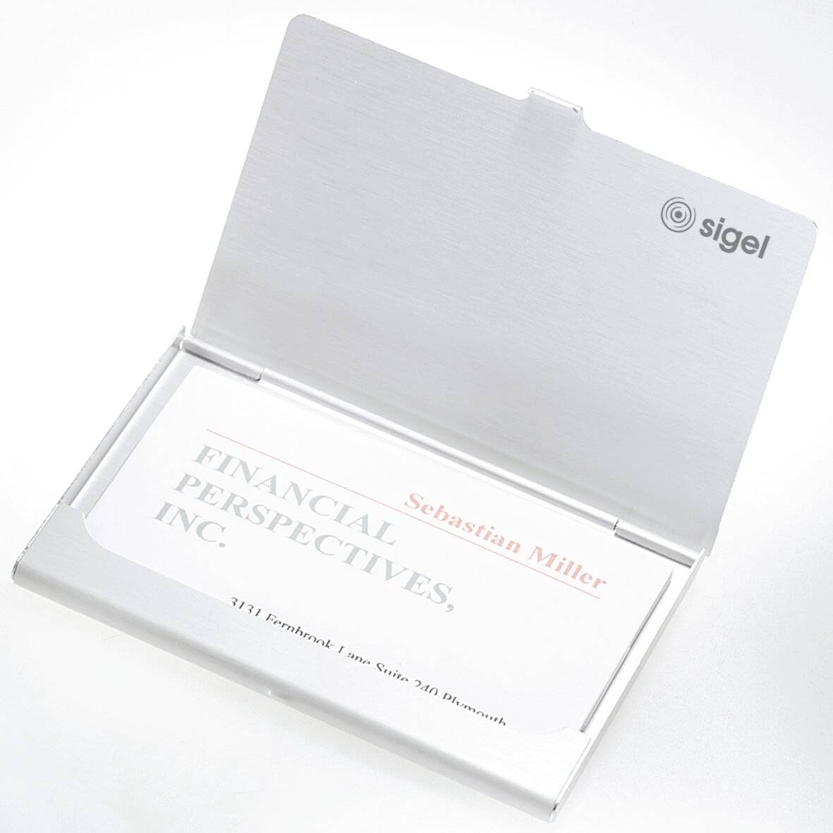 An open business card holder showing a card with the text 'FINANCIAL PERSPECTIVES, INC.' and contact details in a minimalistic design.
