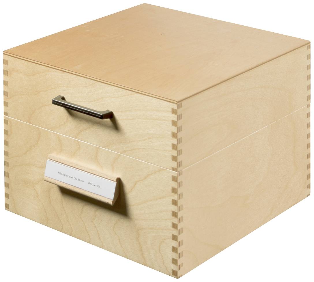 Wooden box with two drawers, a rectangular handle on top, a small label underneath, set against a light background.