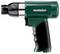'A Metabo pneumatic air tool with a green body and black grip, designed for industrial use, lies flat and angled to the left.'