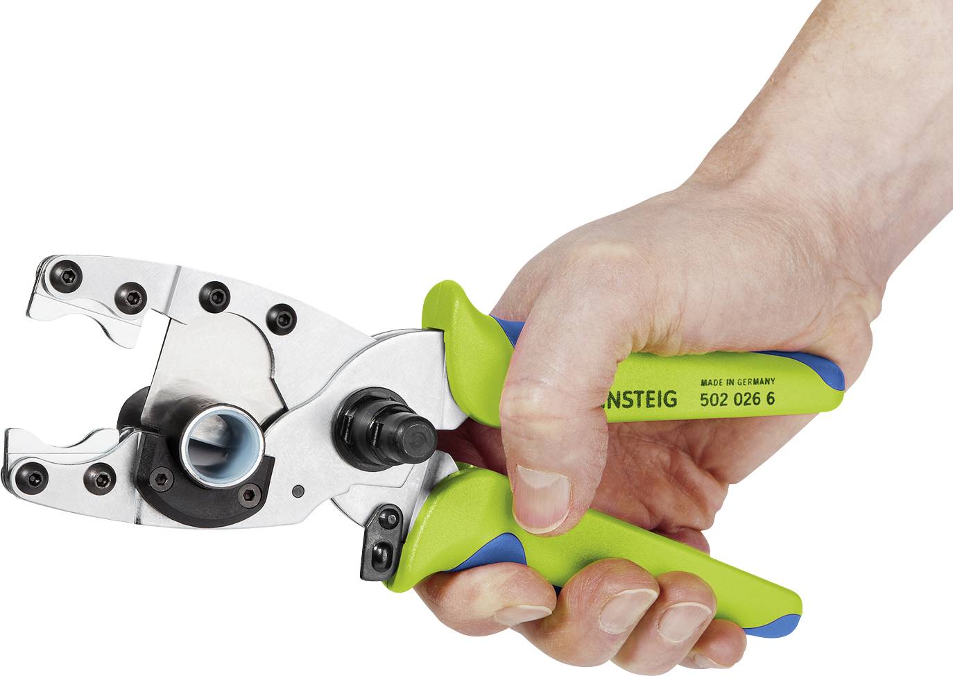A hand is holding a green and blue crimping pliers used for processing cable connections.