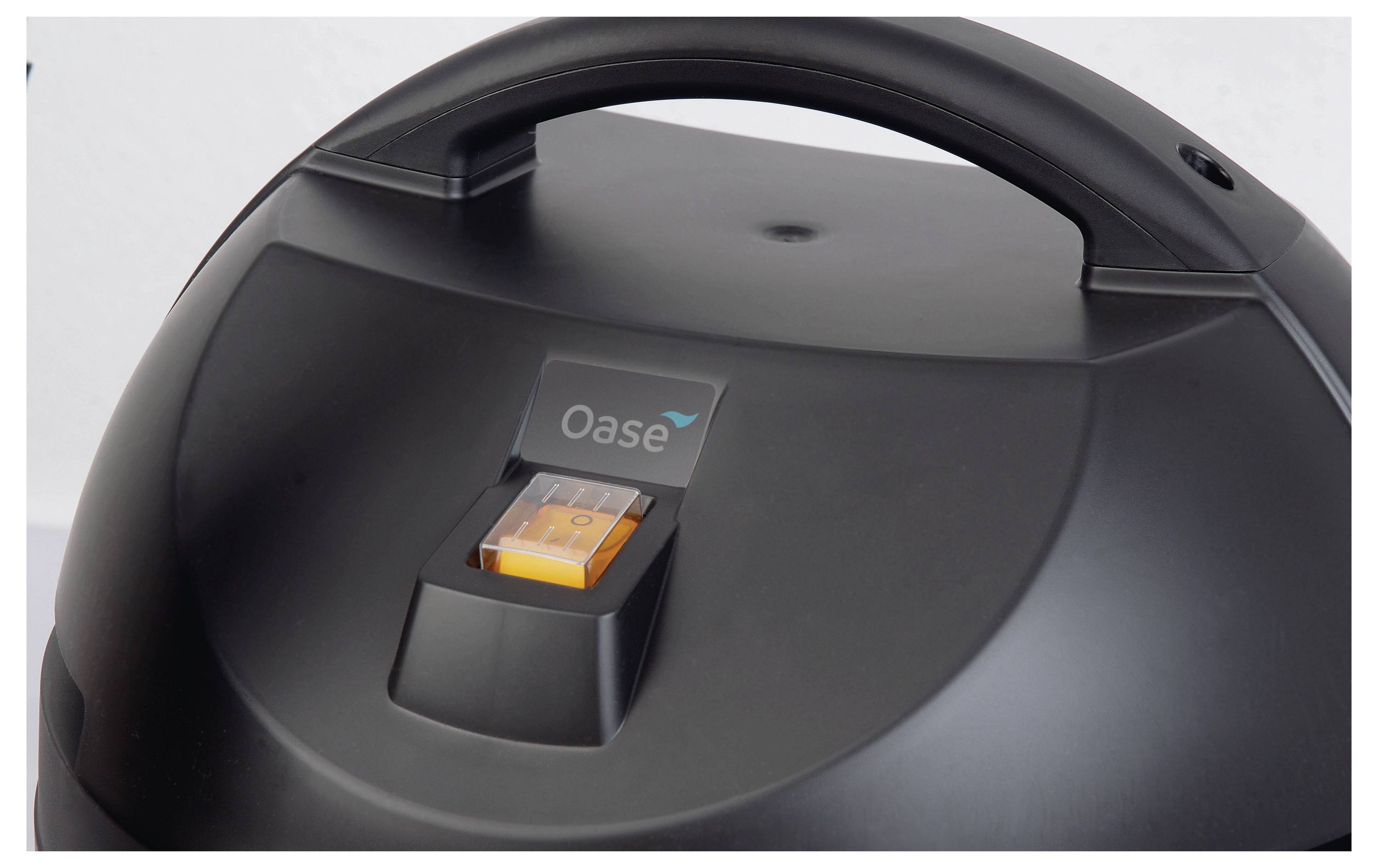 A black device with a handle, featuring an orange switch and a 'Oase' logo above it.
