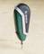 A green Bosch cordless screwdriver with a black handle stands upright on a wooden surface, with a screwdriver bit pointing downwards.