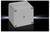 A grey, square plastic box with slightly rounded corners and four screws at the corners on a black background.