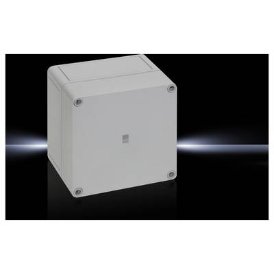 A grey, square casing with rounded corners. It stands before a dark background with a faint beam of light.