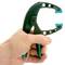 A hand is holding a black plastic plate lifter with a blue insert. The device is designed for easily lifting hot plates.