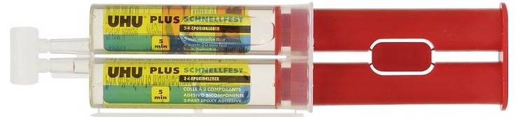 Double-chamber syringe with 'UHU Plus Rapid' inscription and red handle. Contains epoxy resin adhesive for quick and strong bonding.